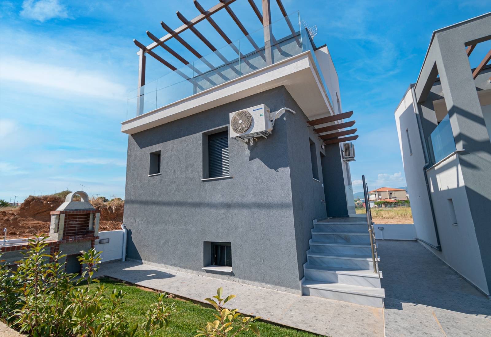 Beautiful exterior design of Asteria Mare with greenery