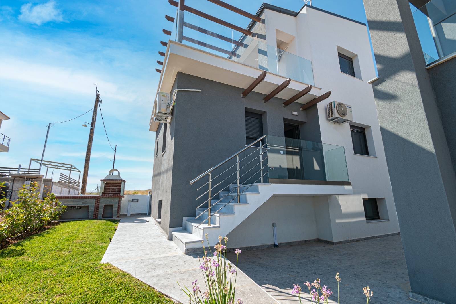 Elegant exterior design of Asteria Mare with patio