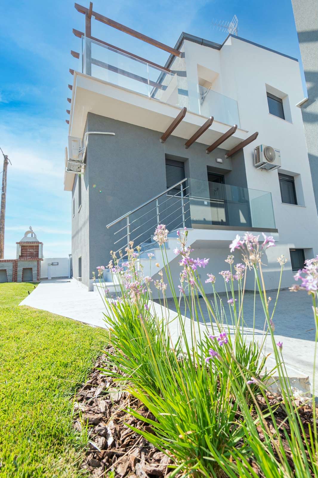 Charming exterior design of Asteria Mare with garden