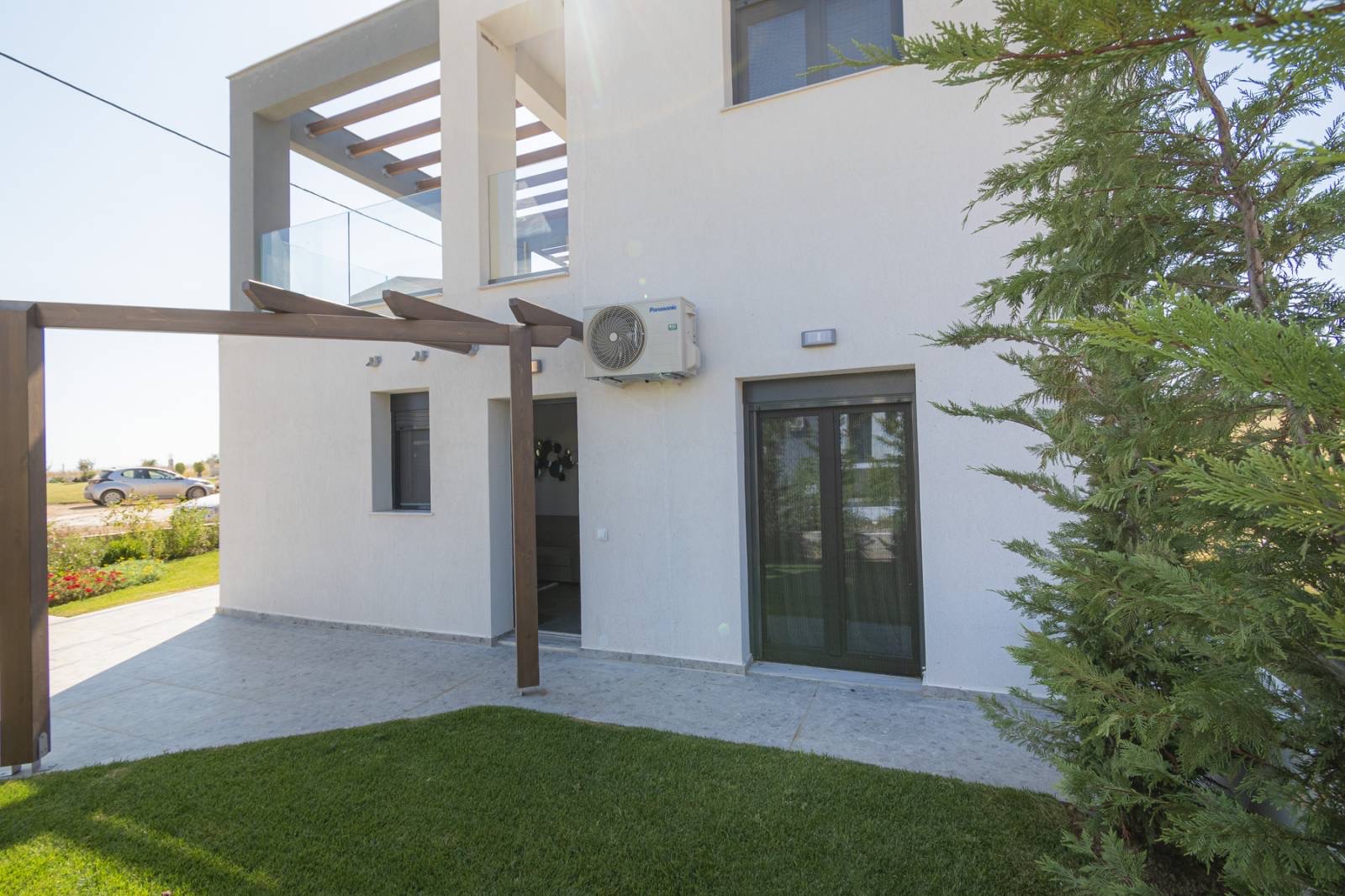 Charming exterior design of Asteria Mare with garden